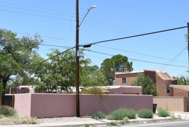 Charming North Campus location! This pueblo style  home has on North Course - University of New Mexico  in New Mexico - for sale on GolfHomes.com, golf home, golf lot