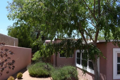 Charming North Campus location! This pueblo style  home has on North Course - University of New Mexico  in New Mexico - for sale on GolfHomes.com, golf home, golf lot