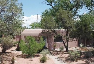 Charming North Campus location! This pueblo style  home has on North Course - University of New Mexico  in New Mexico - for sale on GolfHomes.com, golf home, golf lot