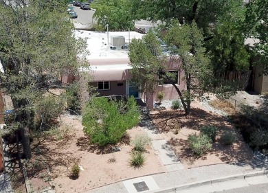 Charming North Campus location! This pueblo style  home has on North Course - University of New Mexico  in New Mexico - for sale on GolfHomes.com, golf home, golf lot