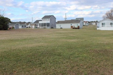 3/1611 Level, cleared lot located in Captains Cove that backs to on Captains Cove Golf and Yacht Club in Virginia - for sale on GolfHomes.com, golf home, golf lot