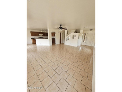 This oversized lot comes with a spacious 4-bedroom 3-bath home on Sundance Golf Club in Arizona - for sale on GolfHomes.com, golf home, golf lot
