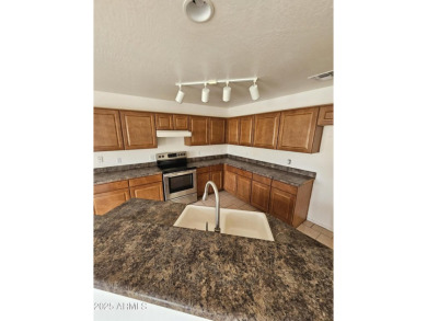 This oversized lot comes with a spacious 4-bedroom 3-bath home on Sundance Golf Club in Arizona - for sale on GolfHomes.com, golf home, golf lot