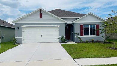 This home features a spacious open floor plan, ideal for cooking on Lake Region Yacht Country Club in Florida - for sale on GolfHomes.com, golf home, golf lot