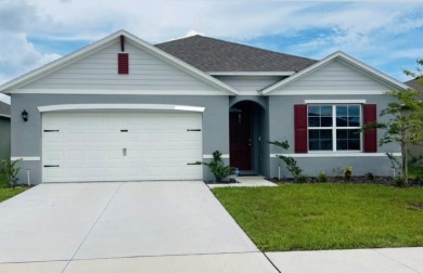 This home features a spacious open floor plan, ideal for cooking on Lake Region Yacht Country Club in Florida - for sale on GolfHomes.com, golf home, golf lot