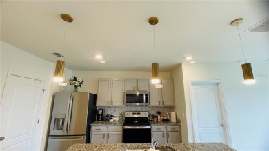 This home features a spacious open floor plan, ideal for cooking on Lake Region Yacht Country Club in Florida - for sale on GolfHomes.com, golf home, golf lot