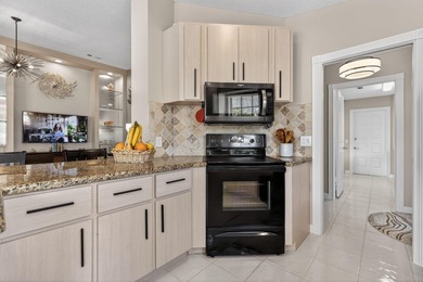 Extremely well-maintained villa with 2 car garage overlooking on The Golf Club of Jupiter in Florida - for sale on GolfHomes.com, golf home, golf lot