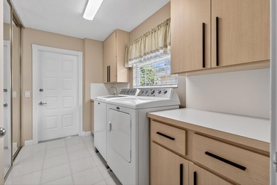 Extremely well-maintained villa with 2 car garage overlooking on The Golf Club of Jupiter in Florida - for sale on GolfHomes.com, golf home, golf lot