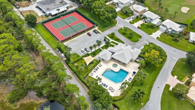 This charming home is perfectly situated on an oversized golf on Riverbend Golf Club in Florida - for sale on GolfHomes.com, golf home, golf lot