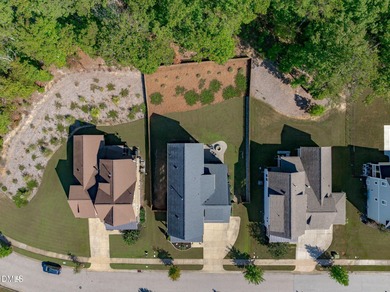 Rocking chair front porch welcomes you to this beautifully on The Club At Twelve Oaks in North Carolina - for sale on GolfHomes.com, golf home, golf lot
