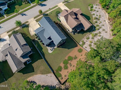 Rocking chair front porch welcomes you to this beautifully on The Club At Twelve Oaks in North Carolina - for sale on GolfHomes.com, golf home, golf lot