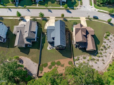 Rocking chair front porch welcomes you to this beautifully on The Club At Twelve Oaks in North Carolina - for sale on GolfHomes.com, golf home, golf lot