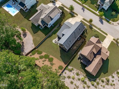 Rocking chair front porch welcomes you to this beautifully on The Club At Twelve Oaks in North Carolina - for sale on GolfHomes.com, golf home, golf lot