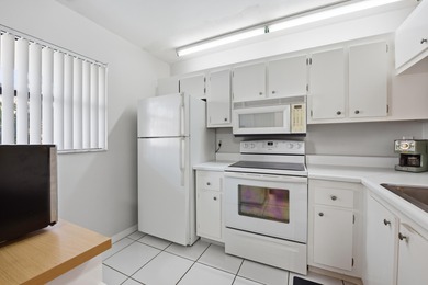 Beautifully maintained 2-bedroom, 2-bath corner unit in on Forest Oaks Golf Club in Florida - for sale on GolfHomes.com, golf home, golf lot