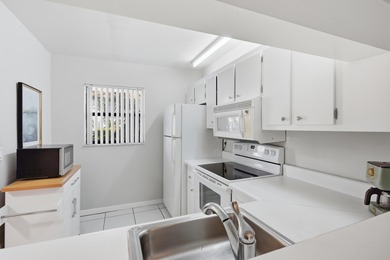 Beautifully maintained 2-bedroom, 2-bath corner unit in on Forest Oaks Golf Club in Florida - for sale on GolfHomes.com, golf home, golf lot