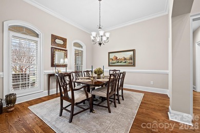 Anchoring a prominent corner lot in Woodbridge North, this on Woodbridge Golf Links in North Carolina - for sale on GolfHomes.com, golf home, golf lot