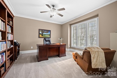 Anchoring a prominent corner lot in Woodbridge North, this on Woodbridge Golf Links in North Carolina - for sale on GolfHomes.com, golf home, golf lot