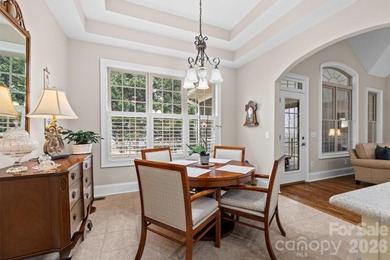 Anchoring a prominent corner lot in Woodbridge North, this on Woodbridge Golf Links in North Carolina - for sale on GolfHomes.com, golf home, golf lot