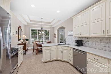 Anchoring a prominent corner lot in Woodbridge North, this on Woodbridge Golf Links in North Carolina - for sale on GolfHomes.com, golf home, golf lot