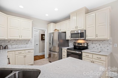 Anchoring a prominent corner lot in Woodbridge North, this on Woodbridge Golf Links in North Carolina - for sale on GolfHomes.com, golf home, golf lot