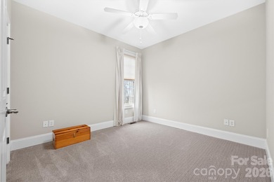 Anchoring a prominent corner lot in Woodbridge North, this on Woodbridge Golf Links in North Carolina - for sale on GolfHomes.com, golf home, golf lot