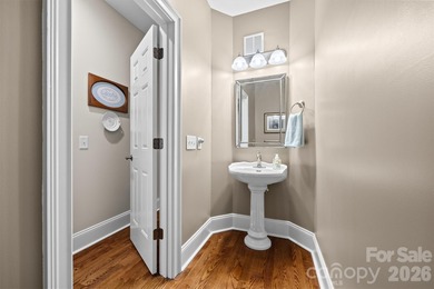 Anchoring a prominent corner lot in Woodbridge North, this on Woodbridge Golf Links in North Carolina - for sale on GolfHomes.com, golf home, golf lot