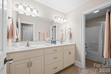 Anchoring a prominent corner lot in Woodbridge North, this on Woodbridge Golf Links in North Carolina - for sale on GolfHomes.com, golf home, golf lot