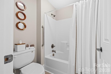 Anchoring a prominent corner lot in Woodbridge North, this on Woodbridge Golf Links in North Carolina - for sale on GolfHomes.com, golf home, golf lot