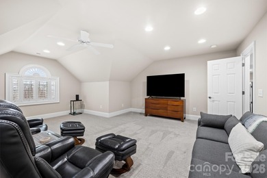 Anchoring a prominent corner lot in Woodbridge North, this on Woodbridge Golf Links in North Carolina - for sale on GolfHomes.com, golf home, golf lot