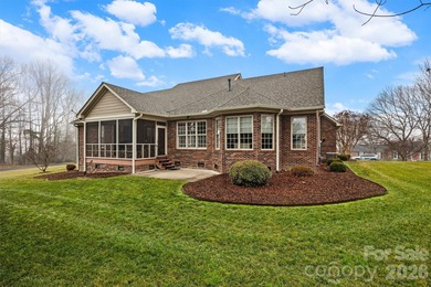 Anchoring a prominent corner lot in Woodbridge North, this on Woodbridge Golf Links in North Carolina - for sale on GolfHomes.com, golf home, golf lot