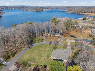 Anchoring a prominent corner lot in Woodbridge North, this on Woodbridge Golf Links in North Carolina - for sale on GolfHomes.com, golf home, golf lot