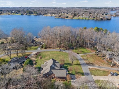 Anchoring a prominent corner lot in Woodbridge North, this on Woodbridge Golf Links in North Carolina - for sale on GolfHomes.com, golf home, golf lot