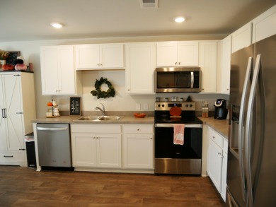 Come Fall in love with this beautiful move-in-ready 2023-built on Santee National Golf Course in South Carolina - for sale on GolfHomes.com, golf home, golf lot