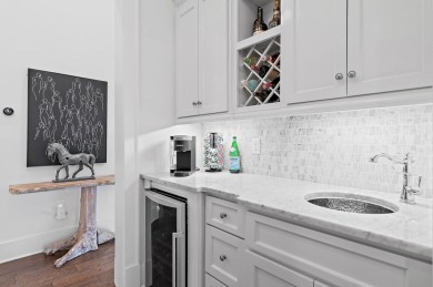 Discover the perfect fusion of modern elegance and artistic on Regatta Bay Golf and Country Club in Florida - for sale on GolfHomes.com, golf home, golf lot