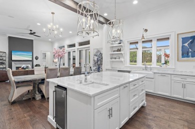 Discover the perfect fusion of modern elegance and artistic on Regatta Bay Golf and Country Club in Florida - for sale on GolfHomes.com, golf home, golf lot