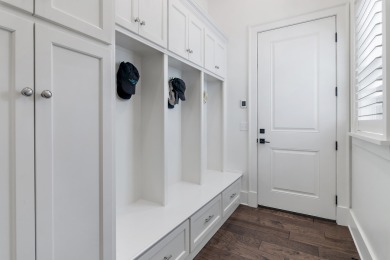 Discover the perfect fusion of modern elegance and artistic on Regatta Bay Golf and Country Club in Florida - for sale on GolfHomes.com, golf home, golf lot