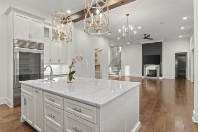 Discover the perfect fusion of modern elegance and artistic on Regatta Bay Golf and Country Club in Florida - for sale on GolfHomes.com, golf home, golf lot