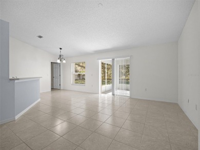 Better Than New! 3 Bed, 2 Bath Home with Screened Porch and on The Grand Club Cypress Course in Florida - for sale on GolfHomes.com, golf home, golf lot