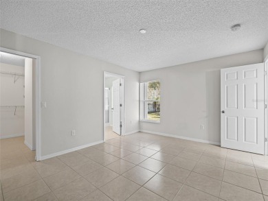 Better Than New! 3 Bed, 2 Bath Home with Screened Porch and on The Grand Club Cypress Course in Florida - for sale on GolfHomes.com, golf home, golf lot