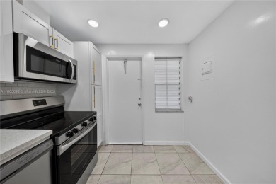 Thoughtfully updated with high-end finishes throughout, this on Palm-Aire Country Club and Resort - Palms in Florida - for sale on GolfHomes.com, golf home, golf lot