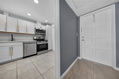 Thoughtfully updated with high-end finishes throughout, this on Palm-Aire Country Club and Resort - Palms in Florida - for sale on GolfHomes.com, golf home, golf lot