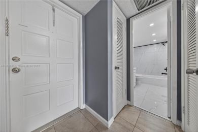 Thoughtfully updated with high-end finishes throughout, this on Palm-Aire Country Club and Resort - Palms in Florida - for sale on GolfHomes.com, golf home, golf lot