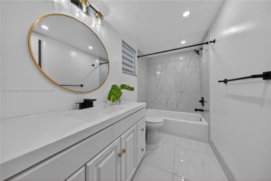 Thoughtfully updated with high-end finishes throughout, this on Palm-Aire Country Club and Resort - Palms in Florida - for sale on GolfHomes.com, golf home, golf lot