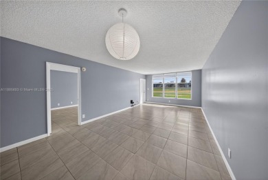 Thoughtfully updated with high-end finishes throughout, this on Palm-Aire Country Club and Resort - Palms in Florida - for sale on GolfHomes.com, golf home, golf lot
