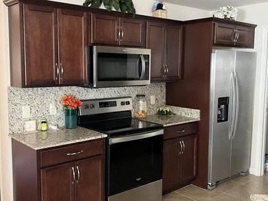 This well-maintained 3-bedroom home features a functional layout on Spanish Lakes I in Florida - for sale on GolfHomes.com, golf home, golf lot