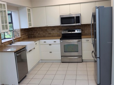 Welcome to this charming 2-bedroom, 2-bath home tucked inside on Tuscawilla Country Club in Florida - for sale on GolfHomes.com, golf home, golf lot