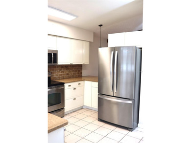 Welcome to this charming 2-bedroom, 2-bath home tucked inside on Tuscawilla Country Club in Florida - for sale on GolfHomes.com, golf home, golf lot