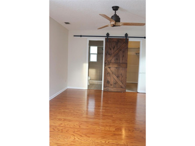 Welcome to this charming 2-bedroom, 2-bath home tucked inside on Tuscawilla Country Club in Florida - for sale on GolfHomes.com, golf home, golf lot