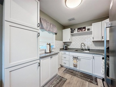 Impressive and charming! You're going to love this updated 2 on Summertree Golf Course in Florida - for sale on GolfHomes.com, golf home, golf lot
