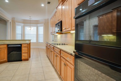 This stunning custom home in Southwood on Grove Park Dr on Southwood Golf Club in Florida - for sale on GolfHomes.com, golf home, golf lot